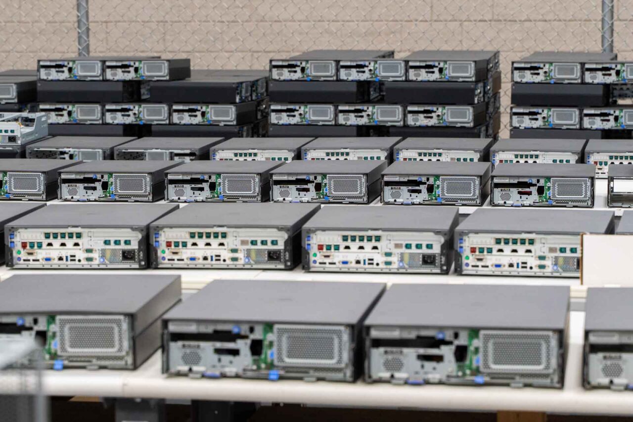 Rows of computer servers neatly aligned, symbolizing our managed services program's control and predictability.