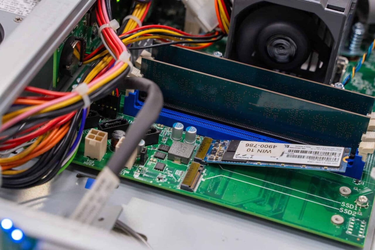 Computer motherboard with RAM and SSD, showcasing major hardware components by our trusted suppliers.